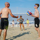 Lachendes Team beim Beachvolleyball